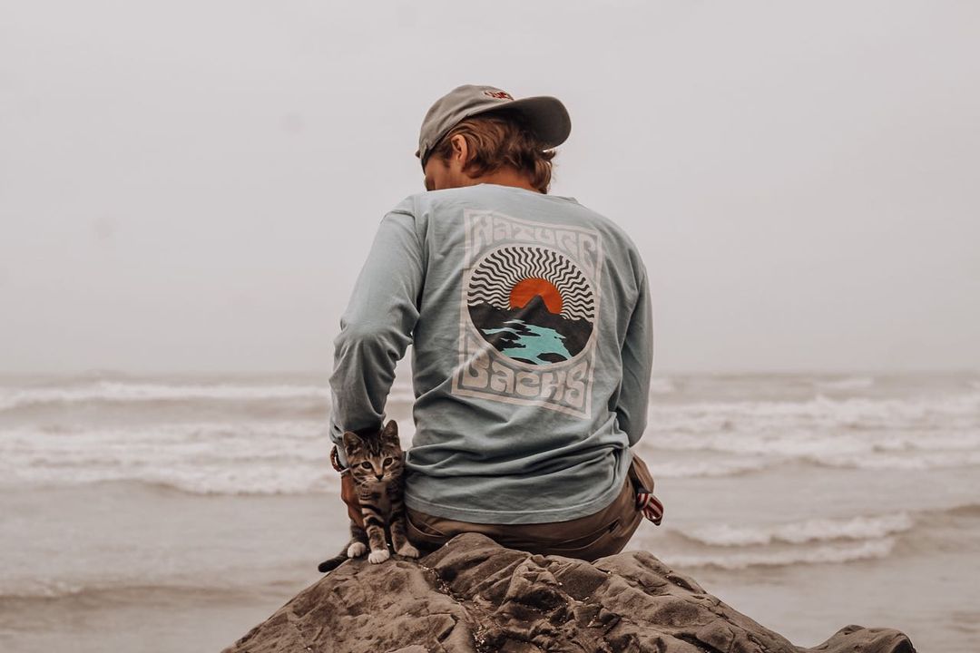 Sublime Breeze Long Sleeve Worn by the ocean with a kitten
