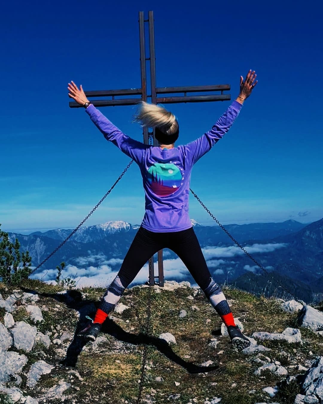 Person Jumping On a Mountain with Twilight Long Sleeve On