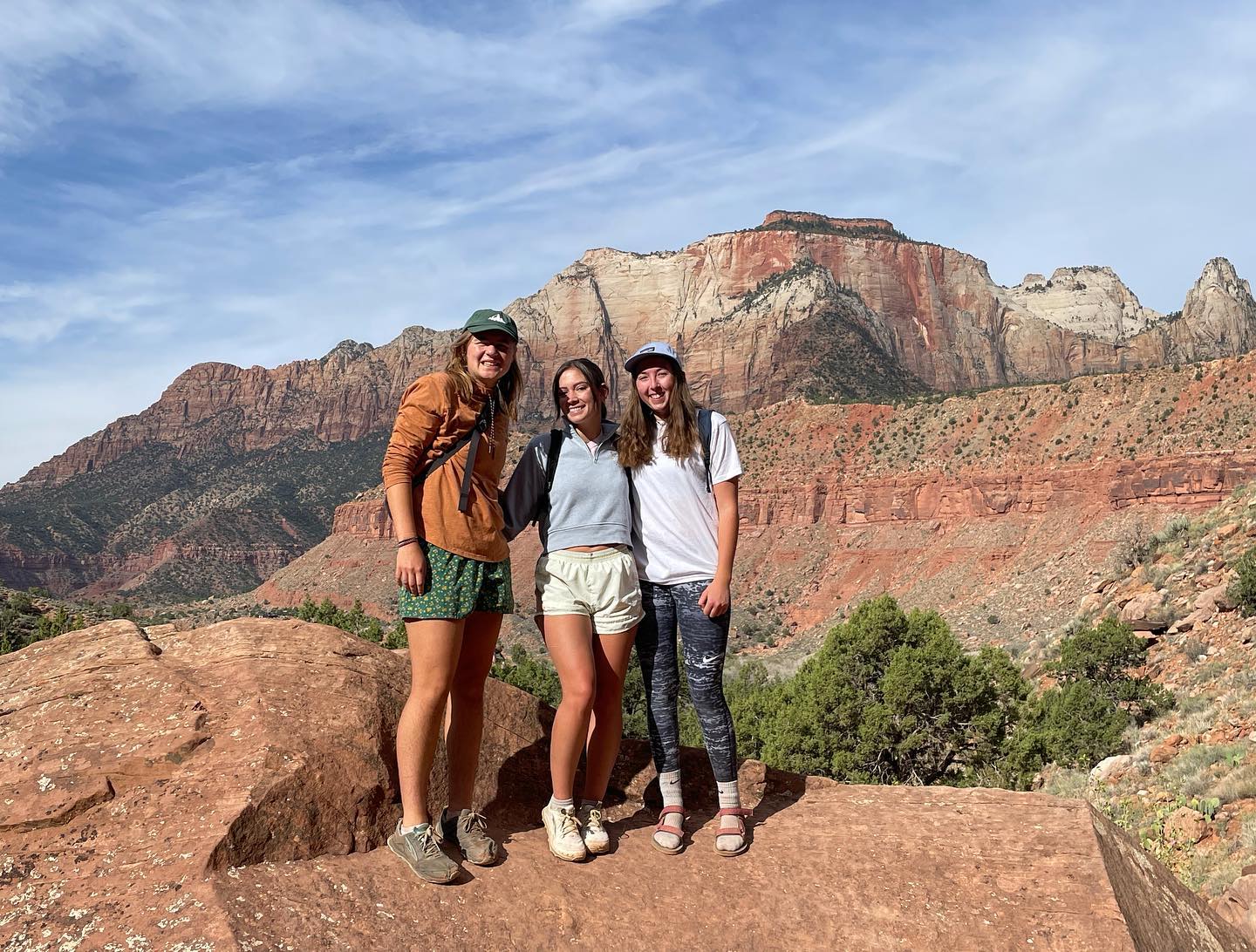 Group of 3 in front of Zion Mountains