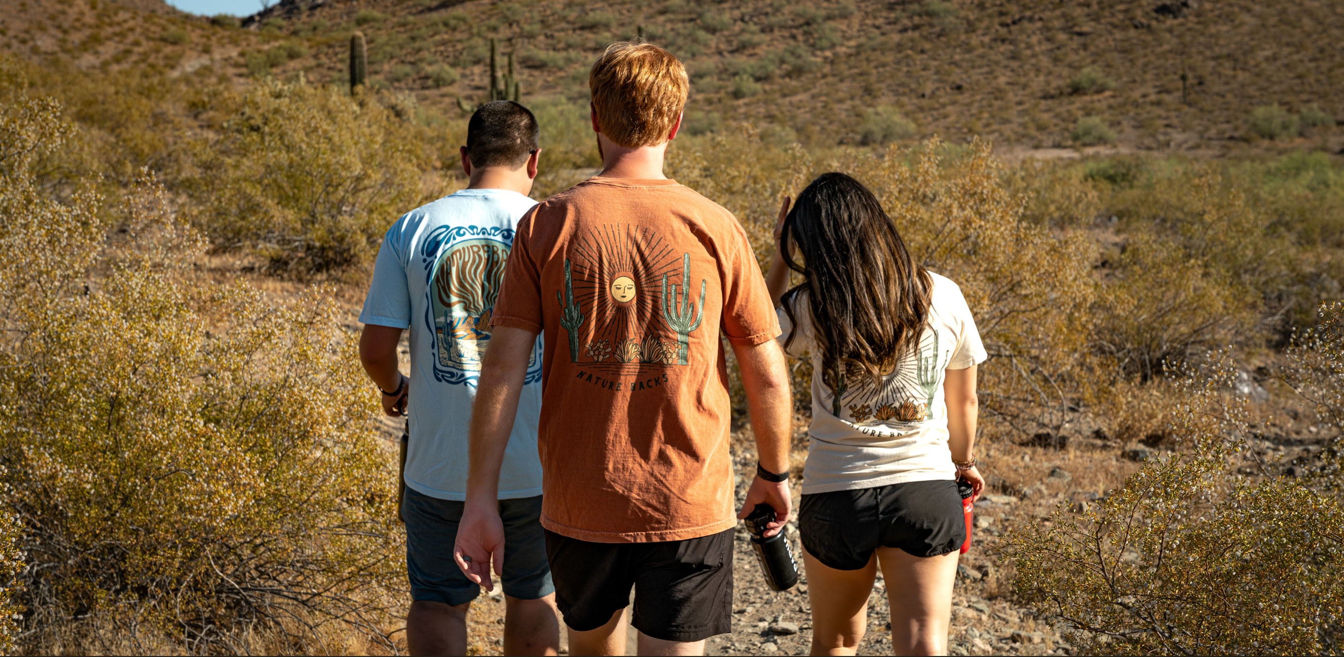 Group Of People Walking Through The Desert
